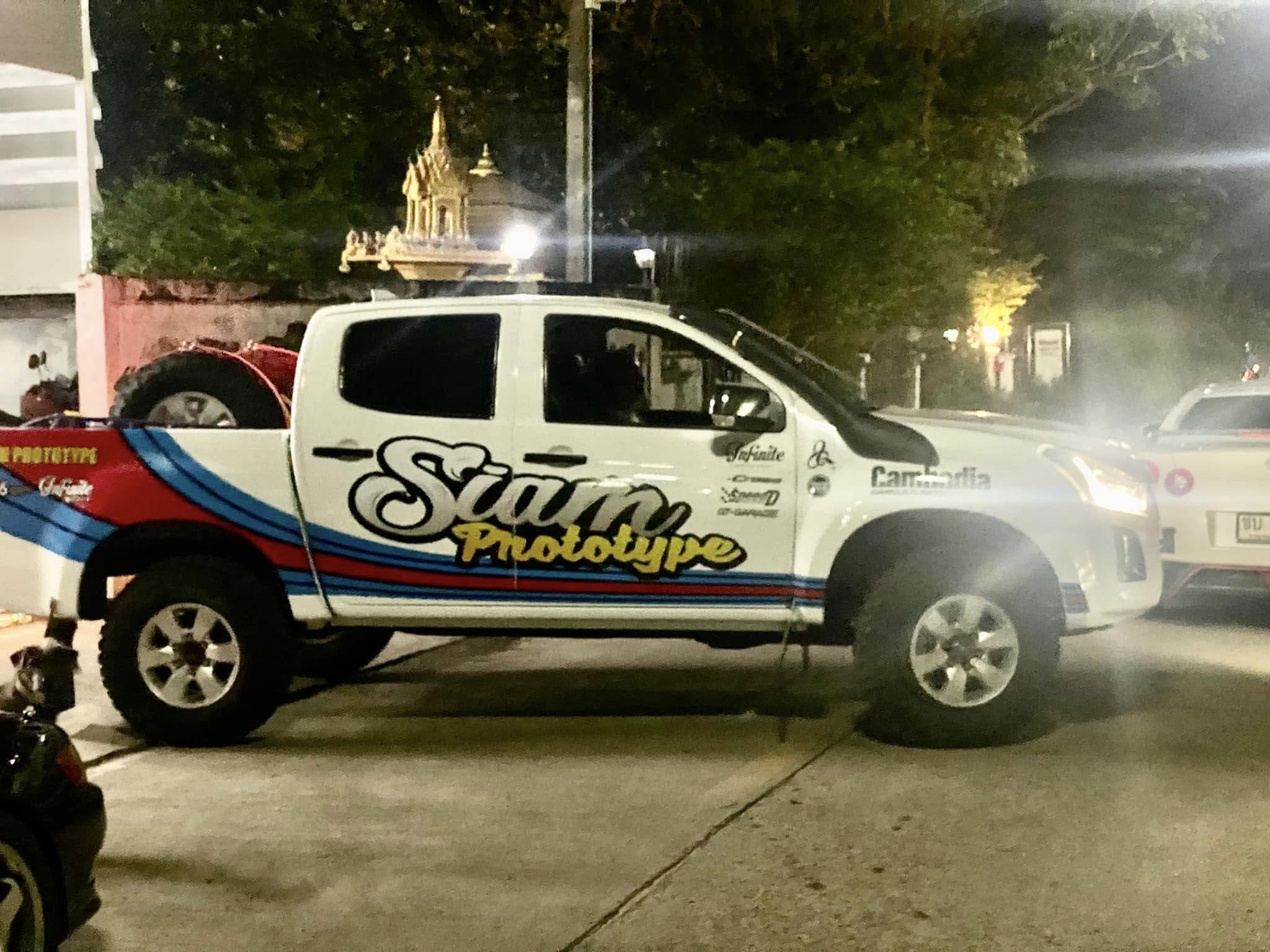 Support van at night with Thai temple