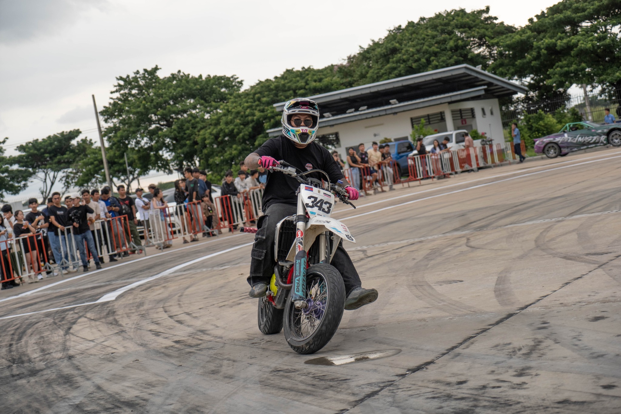 Motorcycle stunt rider performing for the crowd