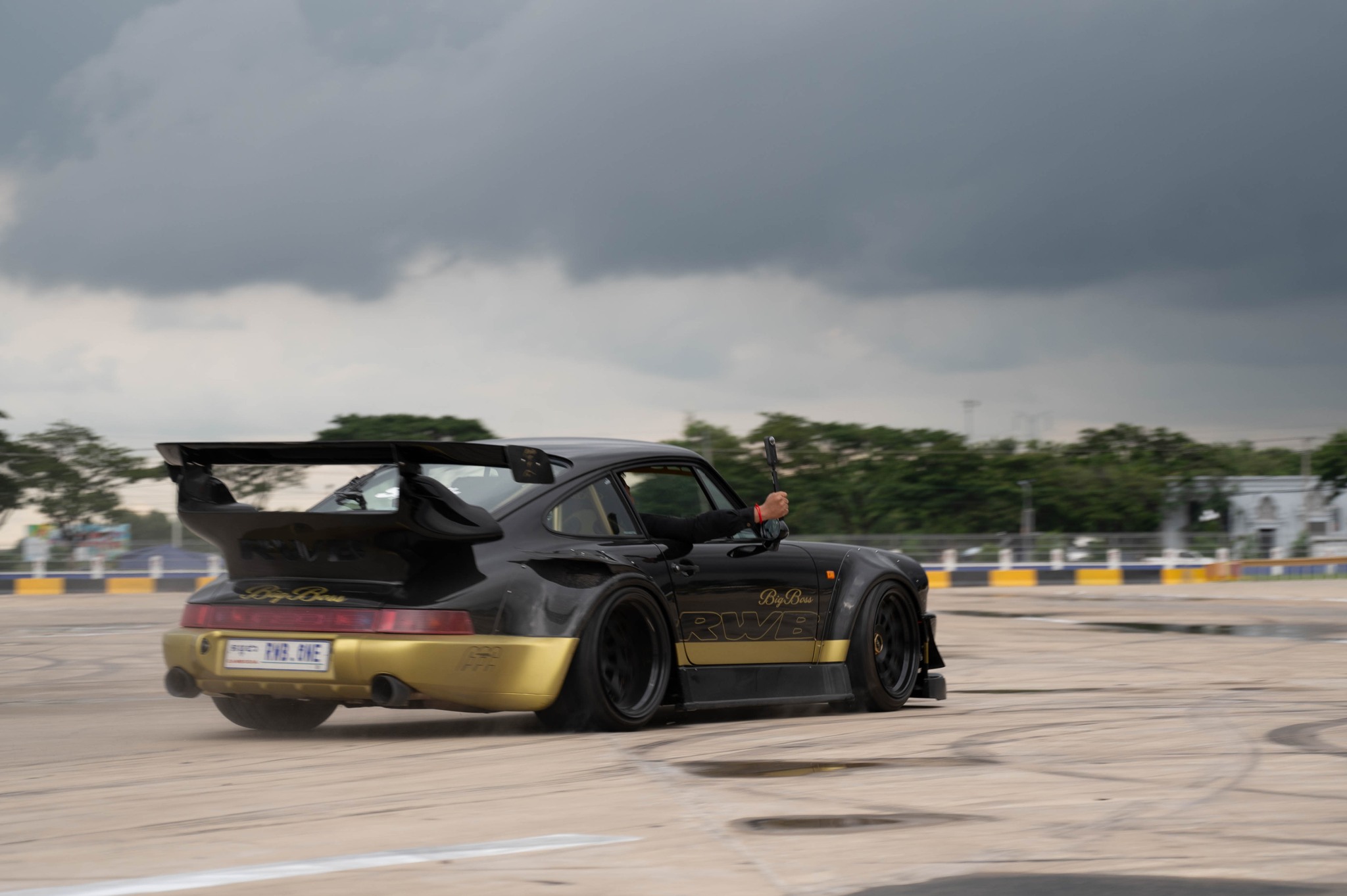 RWB Porsche 993 Big Boss drifting under storm clouds