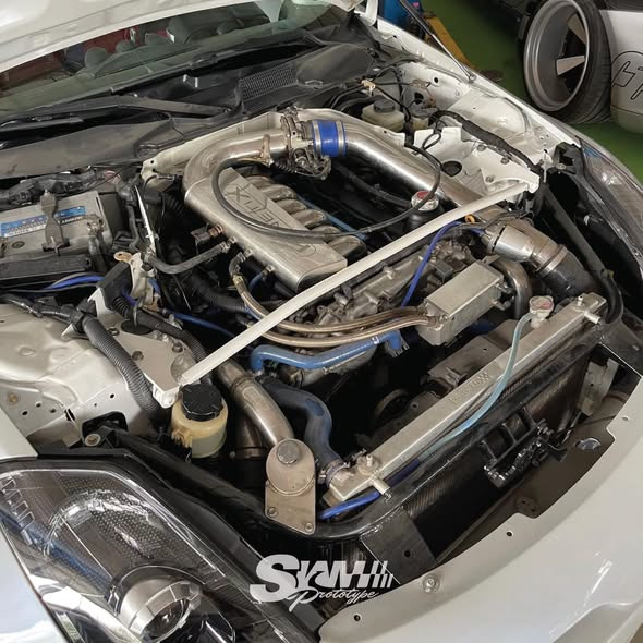 VQ turbo engine bay with strut brace