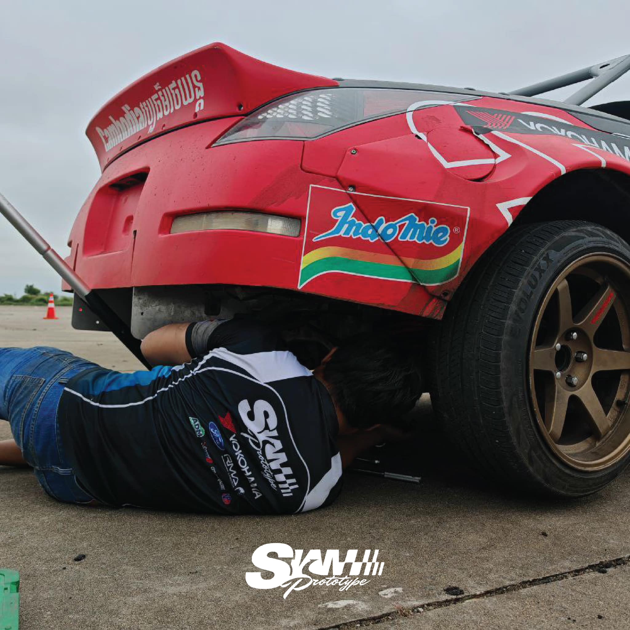 Mechanic working under the 200SX