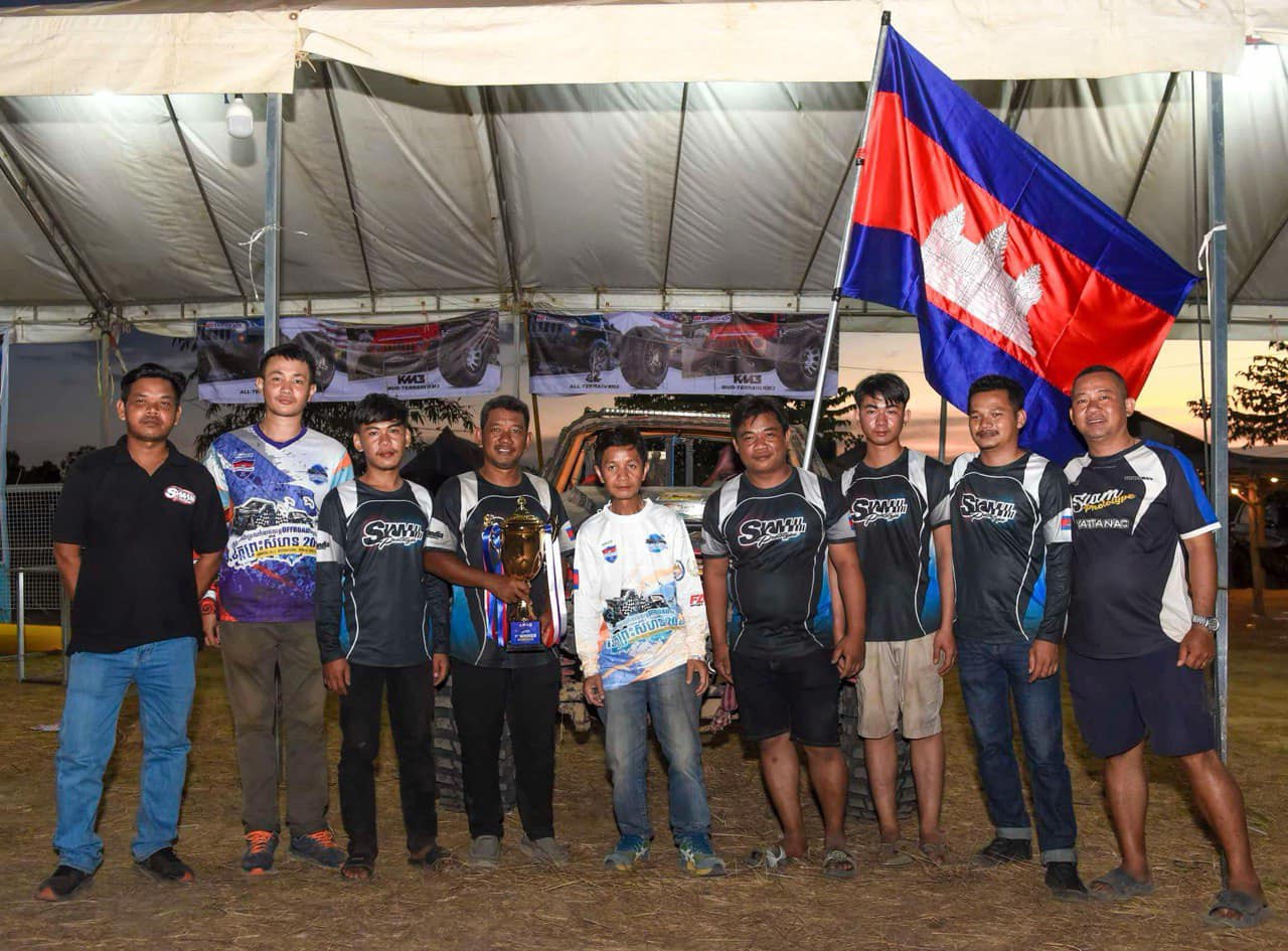 Full team with Cambodian flag