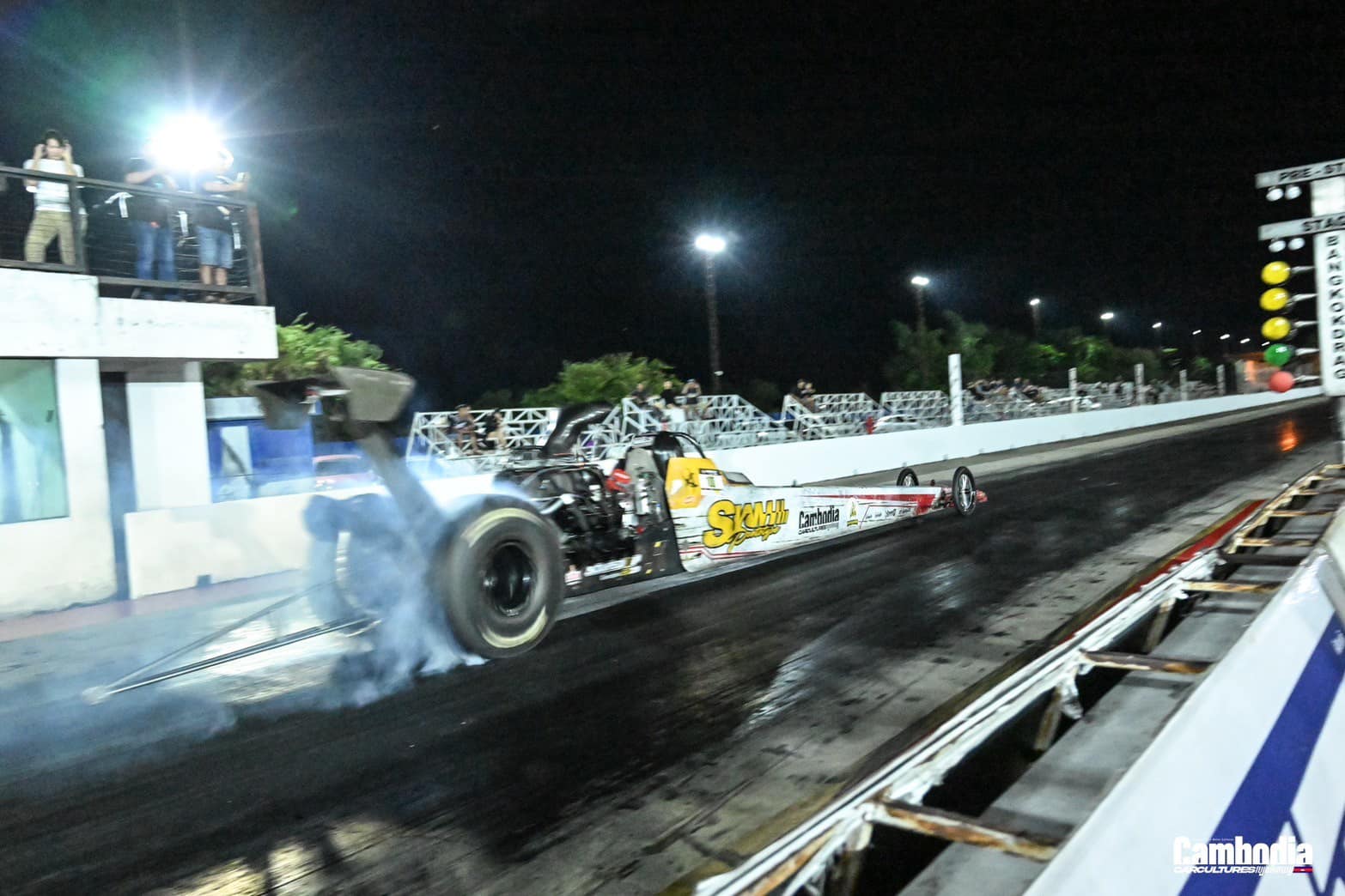 Dragster launching down the strip